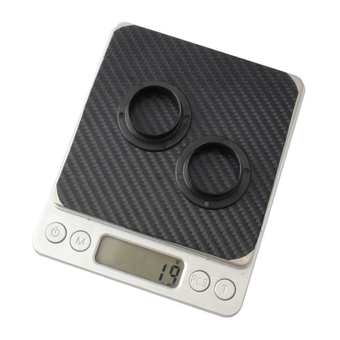Two Pack Black Axle Protection Covers for Bike Bearings Dust Covers on digital scale