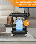 Heavy Duty 2 Shelf Utility Cart Built Tough With 28 By 19 Inches Industrial Plastic Build 330 Pounds Capacity Locking Swivel Wheels Multipurpose Service Rolling Cart For Home Office And Industrial Use shown holding large water bottle indoors