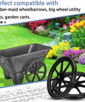 20 Inch Flat Free Wheels Compatible with Rubbermaid Wheelbarrow Tires next to a wheelbarrow on a grassy garden.