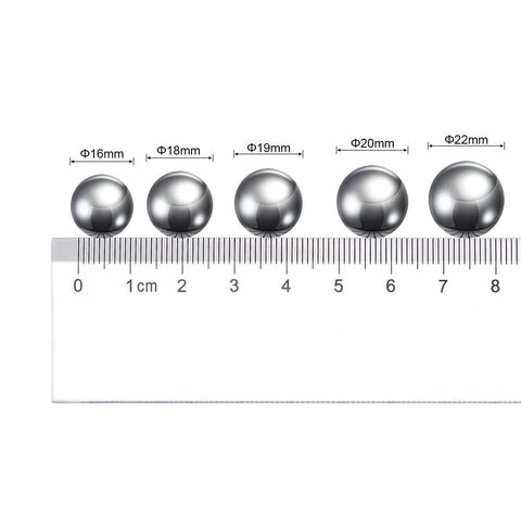 20mm carbon steel bearing balls next to a ruler, showcasing precision polished surface. Part of 10pcs 20mm Carbon Steel Bearing Balls Precision Polished.