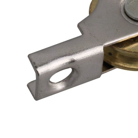 Close-up of metal component from 20mm Slotted Sliding Roller Wheel Set For Wardrobes Cabinets Bookcases And Doors With Copper Wheel And Metal Construction For Durable Smooth Sliding Of Furniture And Window Panels Set Of 20.