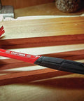 20 oz steel general purpose hammer with an ergonomic vibration-reducing grip, smooth face, and one-piece forged design on a workbench