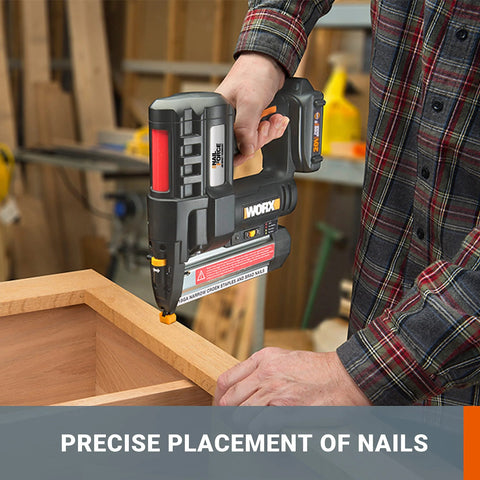 Person using 20V cordless 2-in-1 brad nailer and stapler for trim, cabinetry, and light framing in a workshop setting