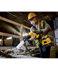 Construction worker using 20V Max SDS Plus Rotary Hammer With One And One Eighth Inch Capacity And Three Point Zero Joules Of Impact Energy