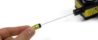 Close-up of 1000mm Draw Wire Linear Displacement Sensor with Incremental Encoder CESI S1000 Pushpull Output in hand.