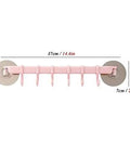 No Drill Hassle Self Adhesive Towel Rack Wall Mount Hook With Hella Strong Grip For Bathroom Kitchen And Living Room Totally Rad Space Saving Storage Solution Smooth Finish in pink with six hanging hooks.