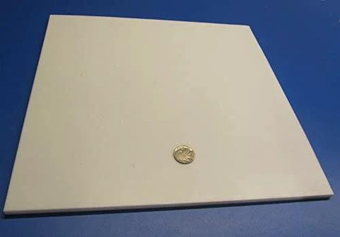 Top view of Virgin PTFE Sheet Quarter Inch Thick 12 By 12 Inches Nonstick High Purity Polytetrafluoroethylene next to a coin for scale.