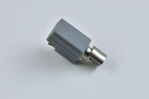 Side view of the Three Volt 4mm Vibration Motor Coin Style; compact grey and metal motor for wearables and DIY gadgets.