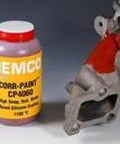 Heavy Hitter Red Silicone Metal Coating Tough Anti Rust High Temp Sealant For Structural Steel Ceramic Quartz Water Based Formula 5 Gallon Bucket next to a metal part.