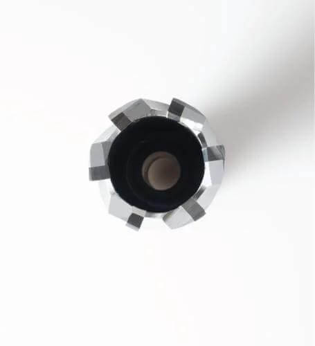 Top-down view: carbide-tipped annular cutter with Weldon shank, silver toothed rim surrounding black center.