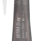 Tube of Ultra Grey RTV Silicone Gasket Maker 3 Oz For High Torque And High Vibration Engines OEM Spec Ideal For Import And Domestic Auto Applications Durable Sealant For Gaskets And Mating Surfaces, with nozzle attachment.