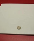 Virgin PTFE Sheet Quarter Inch Thick 12 By 12 Inches Nonstick High Purity Polytetrafluoroethylene on red background with coin for scale