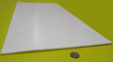 Sheet Three Sixteenth Inch Thick By Twelve By Twenty Four Inches Of PTFE for nonstick surfaces, shown at an angle with a coin for scale.