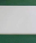 Durable White UHMW Plastic Sheet 5/8 Inch Thick 24 By 24 Inches Built To Last Self Lubricating With Low Friction displayed on green surface