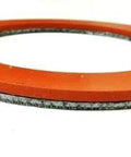 Close-up of a 3-1/2 inch orange silicone rubber gasket with graphite inner layer for vacuum casting perforated flask.