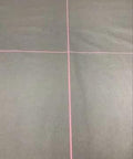 Crosshair alignment tool with red cross lines on a dark gray surface