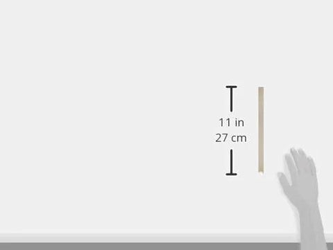 Diagram showing the height of the Kohler Genuine Part 84999 Toilet Seat Anchor Kit with dimensions 11 inches, 27 cm, alongside a hand for scale.
