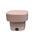 Pretty Slick Portable Mini Washing Machine Compact Folding Washer For Socks Underwear And Baby Clothes Super Lightweight Travel Laundry Gadget in soft pink color.