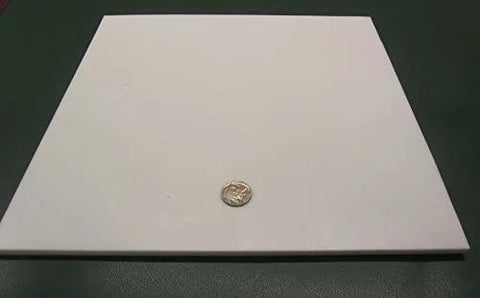 Virgin PTFE Sheet Quarter Inch Thick 12 By 12 Inches Nonstick High Purity Polytetrafluoroethylene with coin for scale