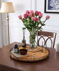 Round 21 Inch Walnut Wooden Lazy Susan Turntable Organizer on dining table with decor and flowers