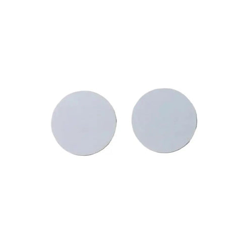 Two round high strength boron nitride ceramic sheets for electronics dielectric insulation and uniform heat dissipation easy clean surface.