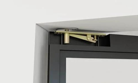 Close-up of pivot hinge and black steel frame on 36 In By 84 In Full Lite Opaque Frosted Glass Interior Pivot Door With Black Steel Frame And Pivot Hinge Hardware Kit Slick Frameless European Style Office Door For Modern Commercial Spaces.