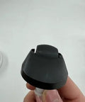 Close-up of omni directional wheel kit for Dreame vacuums, showing the swivel wheel replacement part being held.
