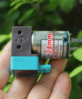 Hand holding 24V Mini Diaphragm Pump, 2W Micro Liquid Water Pump with negative pressure suction, compact for lab analysis and precise metering