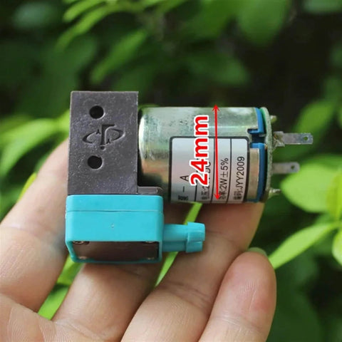 Hand holding 24V Mini Diaphragm Pump, 2W Micro Liquid Water Pump with negative pressure suction, compact for lab analysis and precise metering