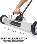 Person using 24 Inch Rolling Magnetic Floor Sweeper with 50 Pound Capacity and Adjustable Handle from 29 to 42 Inches for debris pickup.