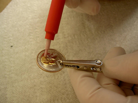 Using Brush Plating Kit With 24K Gold Solution Complete Gold Plating System for precise gold finish on a coin.