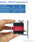 Image of a hand holding a 25 Kg High Torque Full Metal Gear Digital Servo Motor for robotic arms, shown with mount brackets.