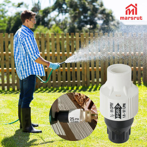 Man using 25 PSI Pressure Regulator for Drip Irrigation and Sprinkler Systems with Three Quarters Inch FPT Female Threads in garden