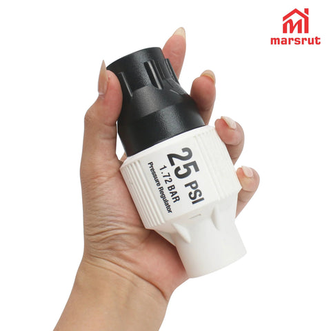 Hand holding 25 PSI Pressure Regulator for Drip Irrigation and Sprinkler Systems with Three Quarters Inch FPT Female Threads