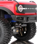 Close-up of 1/18 TRX4M with 25T Servo Horn Upgrade installed, featuring aluminum CNC machined construction in black and red anodized finish.