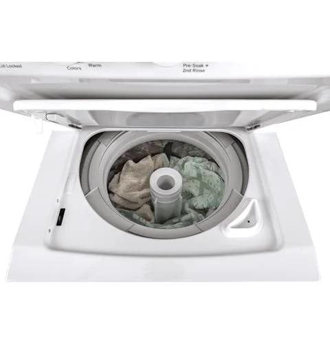 Compact 27 inch unitized washer and electric dryer in one space-saving cabinet with 3.8 cu ft top-load washer open view