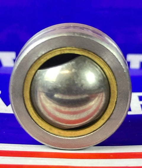 Close-up of PB10 Spherical Plain Bearing 10x26x10.5/14mm showing copper-alloy bushing and smooth metal sphere.