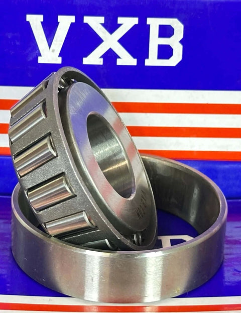 15101/15244 Tapered Roller Bearing 1" x 2.440" x 0.8125" inch, close-up of chrome steel cone and cup on branded packaging