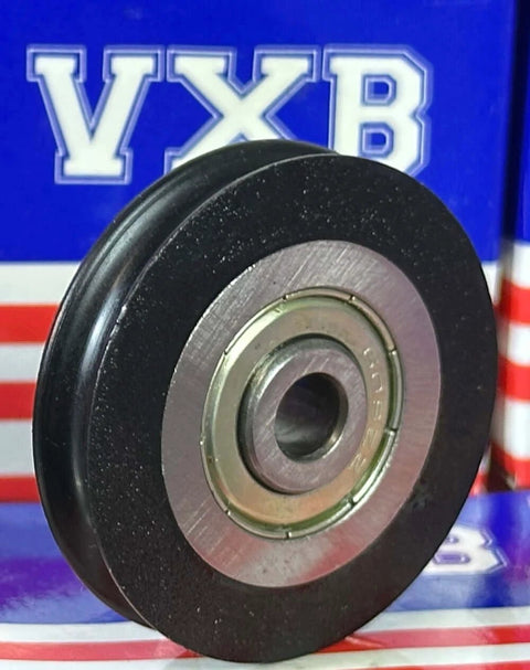 Front view of 6mm Bore Bearing - 39mm Wire Rope Cable Track Roller Pulley 6x39x8mm with nylon and rubber, against branded packaging