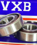 Close-up of 2-Pack Angular Contact Bearings 7204B 20x47x14mm made of Chrome Steel, showcasing front view on branded packaging background.