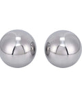 Two 2 Inch Diameter Hardened Chrome Steel Bearing Balls Two Piece Set for Precision Machines, polished and reflecting light.