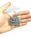 Hand holding Heavy Duty 3/16 Inch By 1 Inch Dowel Pins 15 Pack For Woodworking And Shelving Alloy Steel Ground Precision Pins