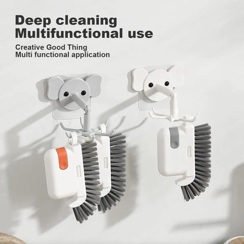 3-In-1 Removable Window Slot Brush With Hidden Scraper, orange and white, hanging on hooks for groove and track cleaning.