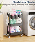 Heavy Duty 3 Tier Metal Rolling Cart With Wheels Ultra Sturdy Mesh Shelves Built In Hooks And Hanging Cups 110 Lbs Total Load Capacity With 36 Lbs Per Shelf Perfect For Kitchen Office Or Craft Room Lightweight Yet Tough Steel Design YASONIC shown next to washing machine loaded with laundry supplies