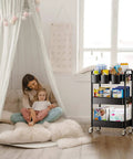 Heavy Duty 3 Tier Metal Rolling Cart With Wheels Ultra Sturdy Mesh Shelves Built In Hooks And Hanging Cups 110 Lbs Total Load Capacity With 36 Lbs Per Shelf Perfect For Kitchen Office Or Craft Room Lightweight Yet Tough Steel Design YASONIC shown in a cozy living room setting.