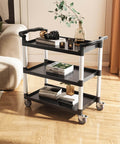 Heavy Duty 3 Tier Utility Cart With 360 Degree Swivel Wheels And Brakes, 300 Lb Load Capacity, in living room setup