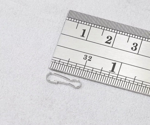 Thirteen Millimeter 304 Stainless Steel Spring Clip Hooks Rust Proof Lanyard Snap Clips Pack Of 50 shown with a measuring ruler