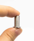 Replacement Bearing Sleeves For 3220 Coffee And Juice Dispenser Jet Spray Machines 304 Stainless Steel 1 Pc shown between fingers