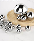 304 Stainless Steel Balls, 20mm Solid Small Steel Balls for Ball Bearings Steel Beads Slingshot displayed on wooden board
