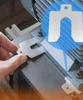 Hand installing a 304 stainless steel slotted shim from a 40 piece kit, with laser cut precision for auto machinery and cabinet work alignment.